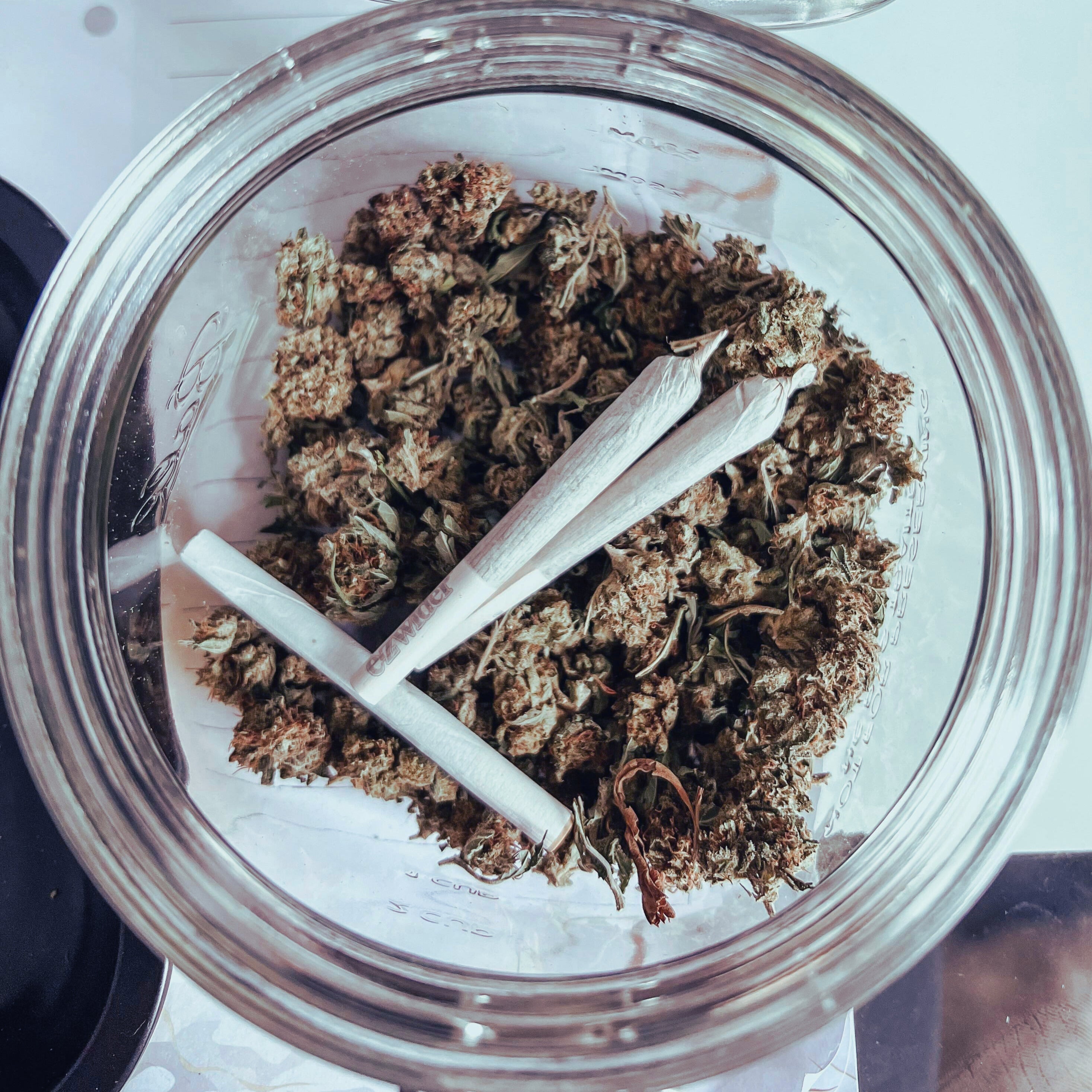 Glass jar filled with small THCa flower buds and pre-rolls from StreetStem’s Value Collection.